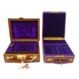 Two early 20th century velvet lined leather jewellery cases,