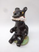 Studio pottery glazed model of a seated bear with fish in mouth,