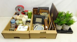Collection of modern photo frames, two graduated lacquer trays, candles,
