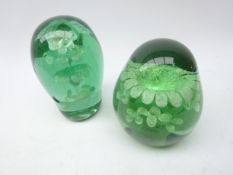 Two Victorian glass dumps with internal flower decoration,