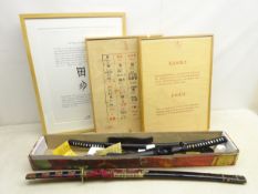 Two graduating replica Japanese Bushido style Samurai swords with stand, boxed,