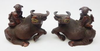 Pair Chinese carved hardwood Buffalo, each with a child on its back,
