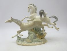 Lladro group of two Galloping Horses,