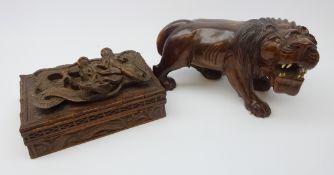 Japanese Meiji carved hardwood figure of a Lion,