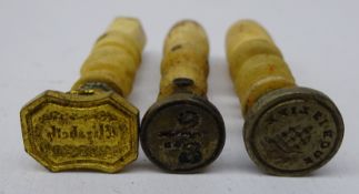 Collection of 19th century desk seals: gilt leg shaped seal, three bone handled, agate handled,