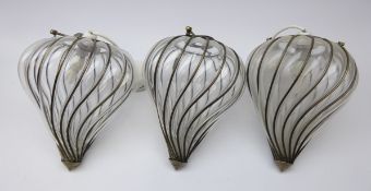 Three blown glass and bronze effect pendant light fittings,