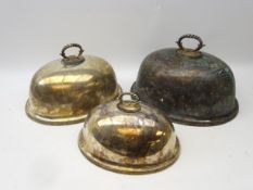 Set of three graduated silver-plated meat/ serving domes with twisted moulded handles and border,