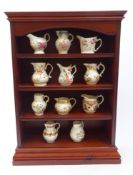 Set of eleven Royal Worcester copies of early English porcelain jugs,