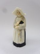 Royal Worcester candle snuffer in the form of a Nun,