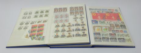 Over one hundred pounds face value of useable postage and a small number of used stamps in two