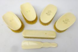 Two pairs of early 20th century ivory mounted brushes,