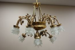 Large twelve branch two tier brass electrolier with frosted glass flower shaped shapes,