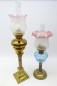Victorian brass Corinthian column oil lamp with brass reservoir and frosted glass shade with pink