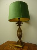 Tall gold Pineapple table lamp with artichoke green velvet shade,