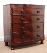 19th century mahogany bow front chest of two short and three long drawers with Trafalgar turned