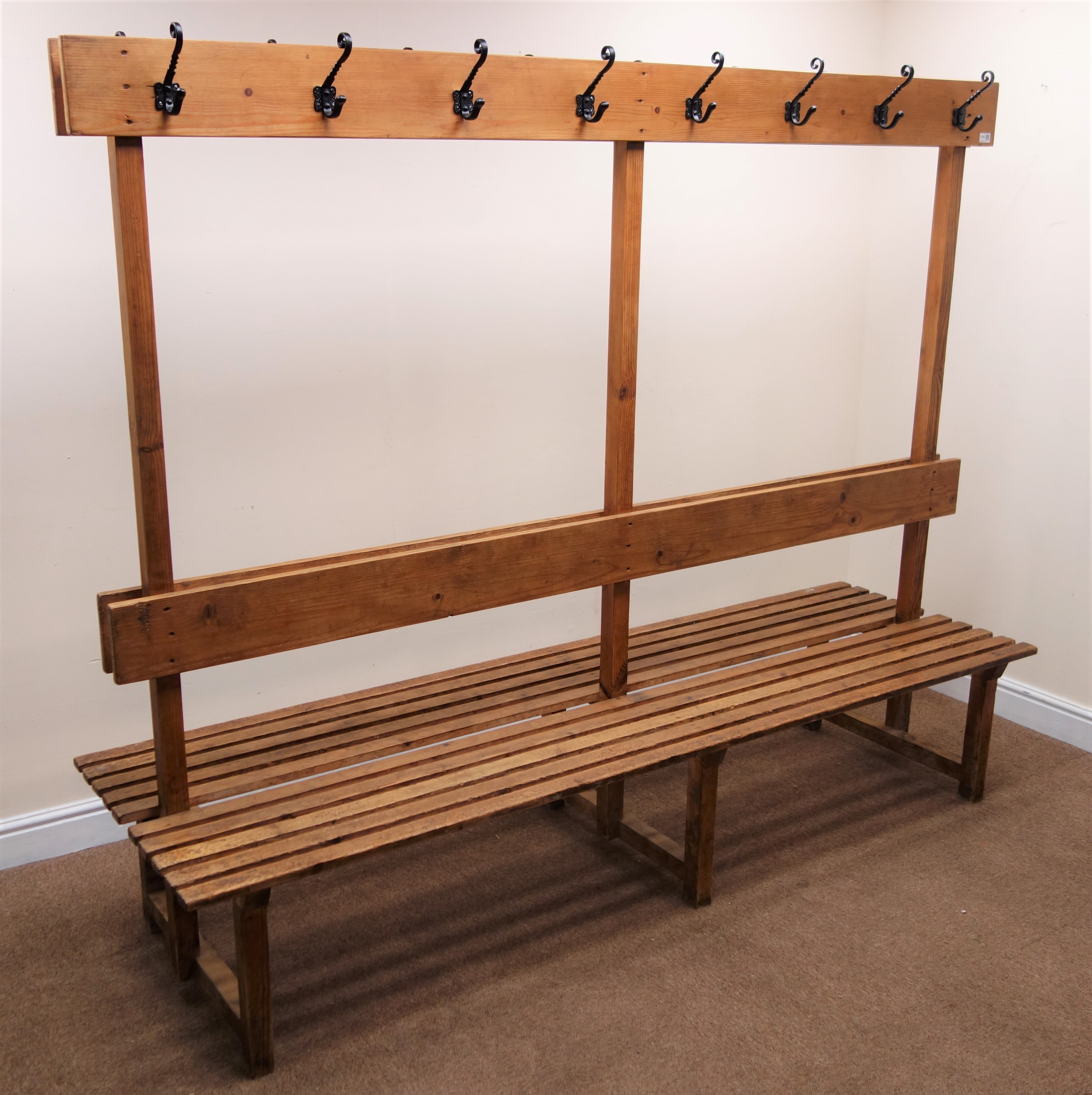 Vintage pine gym changing room back to back benches, raised centre with hooks, W221cm, H180cm,