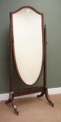 Edwardian mahogany framed shield shaped cheval mirror, two finials, sabre supports,