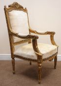 French gilt open armchair, upholstered back, arms and seat, moulded frame, turned tapering supports,