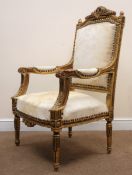 French gilt open armchair, upholstered back, arms and seat, moulded frame, turned tapering supports,