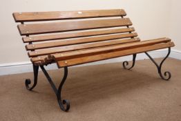 Wrought metal garden bench with solid pine slats,