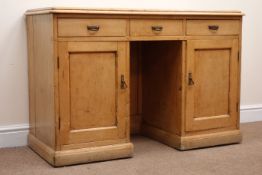 Early 20th century pine twin pedestal desk, two long and one short drawer, two cupboards,