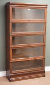 Early 20th century Globe Wernicke five tier oak stacking library bookcase, shaped plinth base,