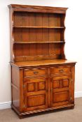 Medium oak dresser, two heights plate rack above two drawers and two panelled doors, by 'S.