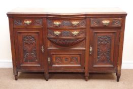Victorian mahogany carved bow break front, two short and two long drawers, three cupboards,