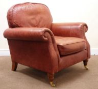 Parker Knoll Westbury armchair, upholstered in a dark tan leather,