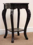 Ebonised heavily carved two-tier jardiniere stand, cabriole legs, W42cm,