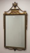 Adams style gilt framed mirror with urn and trailing foliage, W62cm,