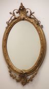 Ornate gilt framed oval mirror, W56cm, H99cm Condition Report <a href='//www.