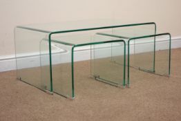 Curved glass nest of three tables, chrome feet, W91cm, H39cm,