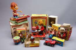 Eight 1960s Japanese clockwork/battery operated tin-plate toys comprising Pinocchio playing