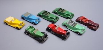 Dinky - eight unboxed and playworn early die-cast models of open touring sports cars including