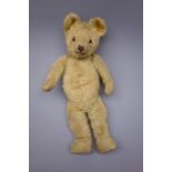 Early 20th century teddy bear, the plush covered body with squeaker mechanism,