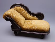 Late 19th/early 20th century doll's chaise longue with mahogany stained carved frame,