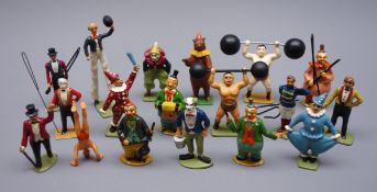 Eighteen predominantly modern die-cast circus figures including clowns, ring masters, stilt walker,