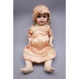German bisque head doll with applied hair, sleeping eyes, open mouth with teeth and tongue,