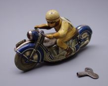 Schuco Mirakomot 1012 clockwork tin-plate motorcycle in blue and grey with brown No.