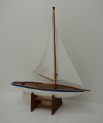 Pond yacht with white painted planked wooden hull, weighted metal keel and two sails L92cm H106cm,