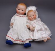 Two Armand Marseille 'My Dream Baby' bisque head dolls, each with moulded hair, sleeping eyes,