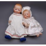 Two Armand Marseille 'My Dream Baby' bisque head dolls, each with moulded hair, sleeping eyes,