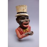 Cast iron mechanical money box as the head and shoulders of a jolly man wearing a white top hat,