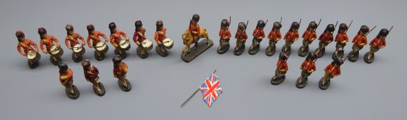 Twenty-four German Elastolin figures of Scots Guardsmen including drummers, standard bearer,