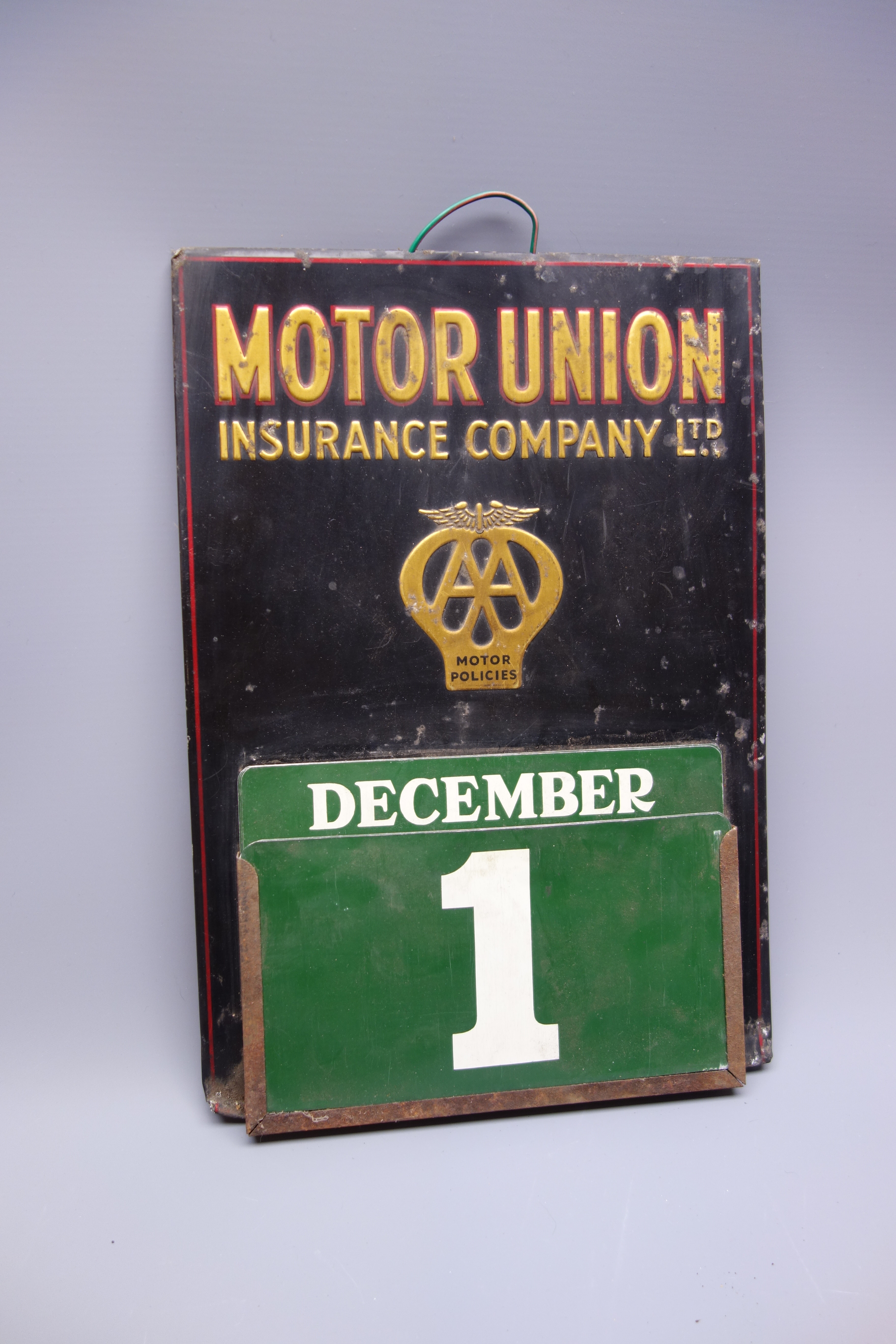 AA Motor Union Insurance Company Limited embossed tin perpetual calendar,