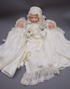 Three Armand Marseille 'My Dream Baby' bisque head dolls, each with moulded hair,