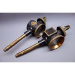 Pair of Victorian black japanned carriage lamps, each with eagle finial and ornate brassed mounts,