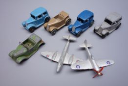 Dinky - four 35 Series die-cast models comprising three 35a Saloon cars and 35d Austin 7 open