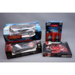 Two Nikko 1:16th scale James Bond radio controlled die-cast model cars - Aston Martin DBS from